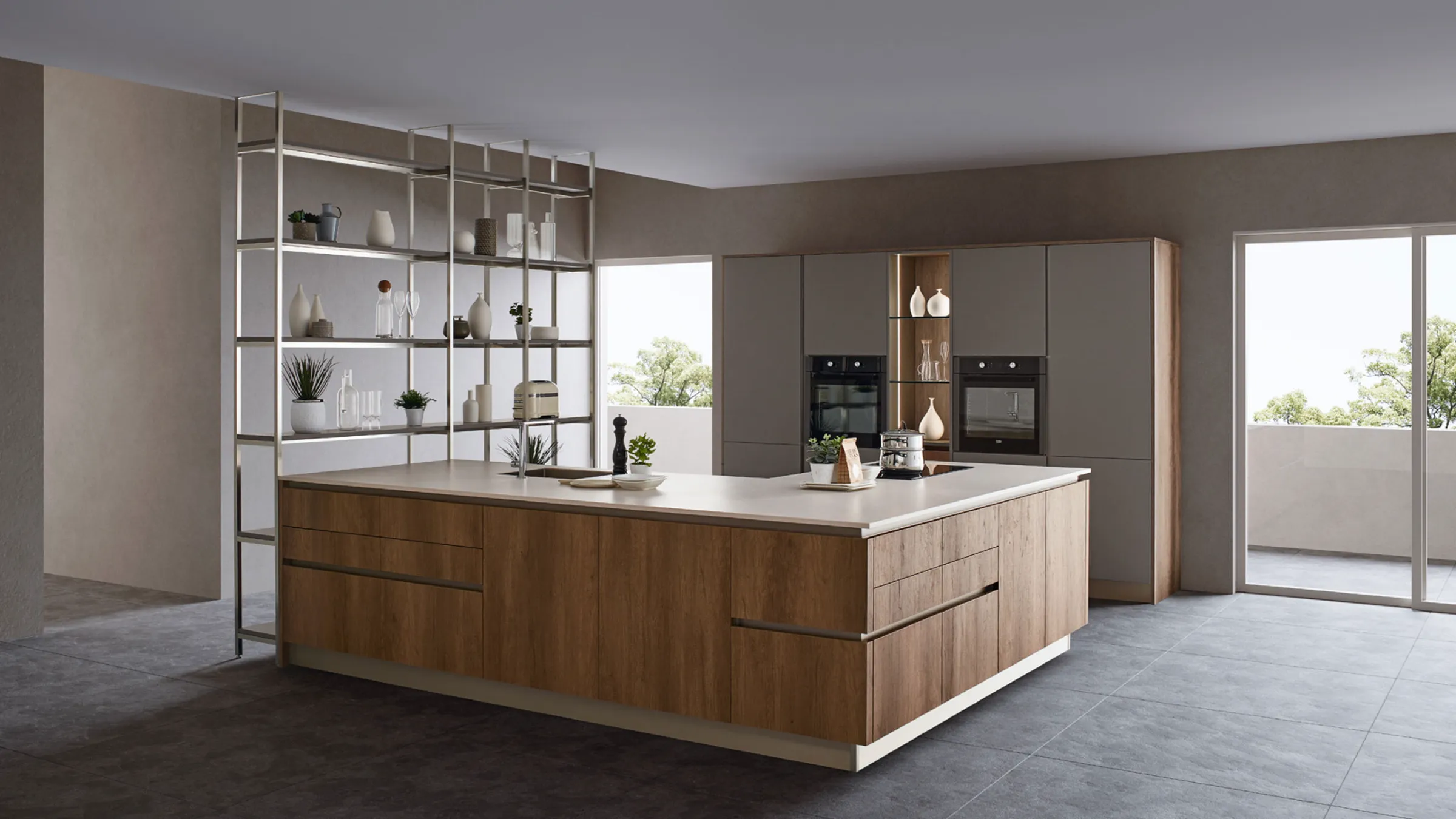Cucina Oyster con isola ad angolo in legno, colonne grigie e libreria in acciaio